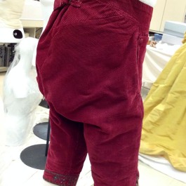 Men's breeches were very ample in the rear. They cinched at the waist with tabs and a little buckle.