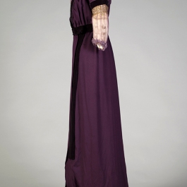 The 1912 purple wool and velvet dress on the custom mannequin from the side. The bust line is lower than on the Kyoto.
