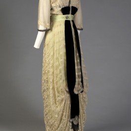 1912 silk and lace evening dress on the custom mannequin shown from the back. The train falls evenly and straight down the back.