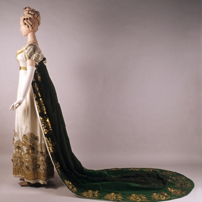 Full profile view of evening dress and court train. KSUM 1983.1.2011 and KSUM 1986.97.28. Collection of the Kent State University Museum.