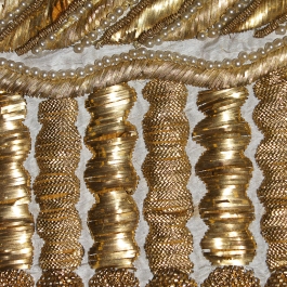 Detail of gold embroidery on ca. 1815 evening dress, KSUM 1987.97.28. Collection of the Kent State University Museum.