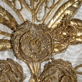 Detail of gold embroidery on ca. 1815 evening dress, KSUM 1987.97.28. Collection of the Kent State University Museum.