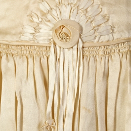 Waist detail showing ribbonwork on wedding dress, KSUM 1983.1.309.