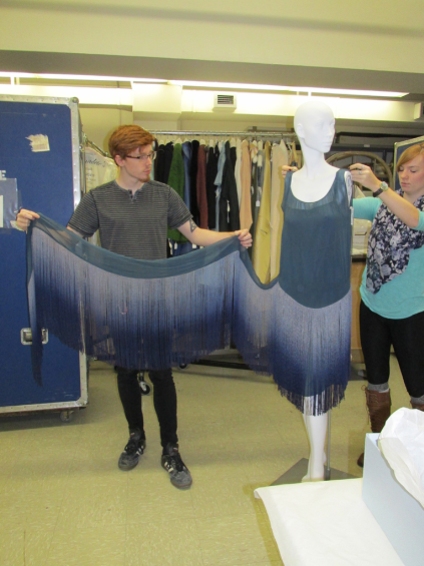 Our Student Assistants Larry Staats and Chloe Wingard demonstrate how the dress is put together.